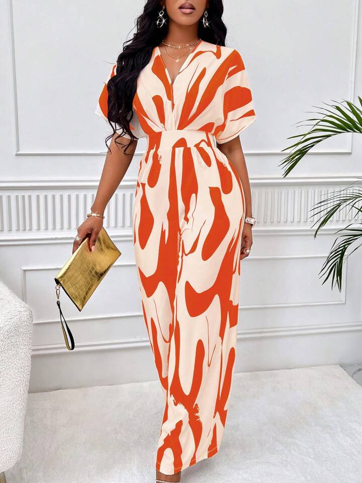 Allover print batwing sleeve jumpsuit in orange