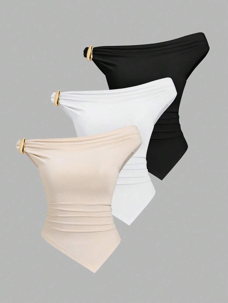 Gold decor twist asymmetric top in white