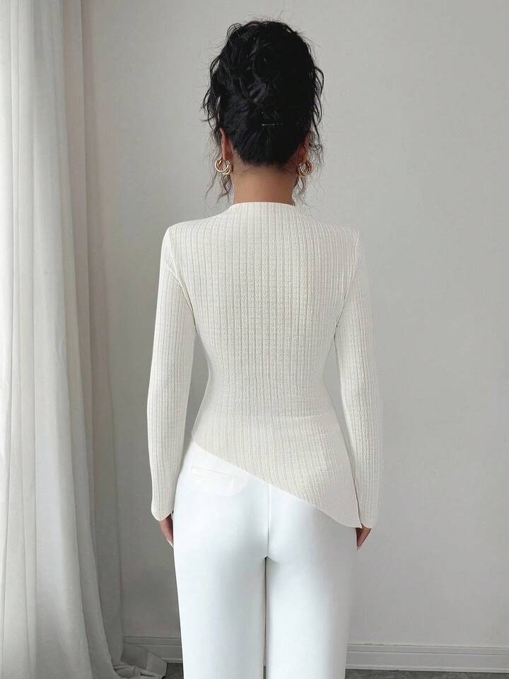 Long sleeve ribbed knit high neck top in cream