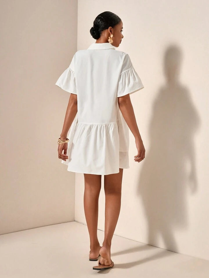 Ruffle hem smock dress in white