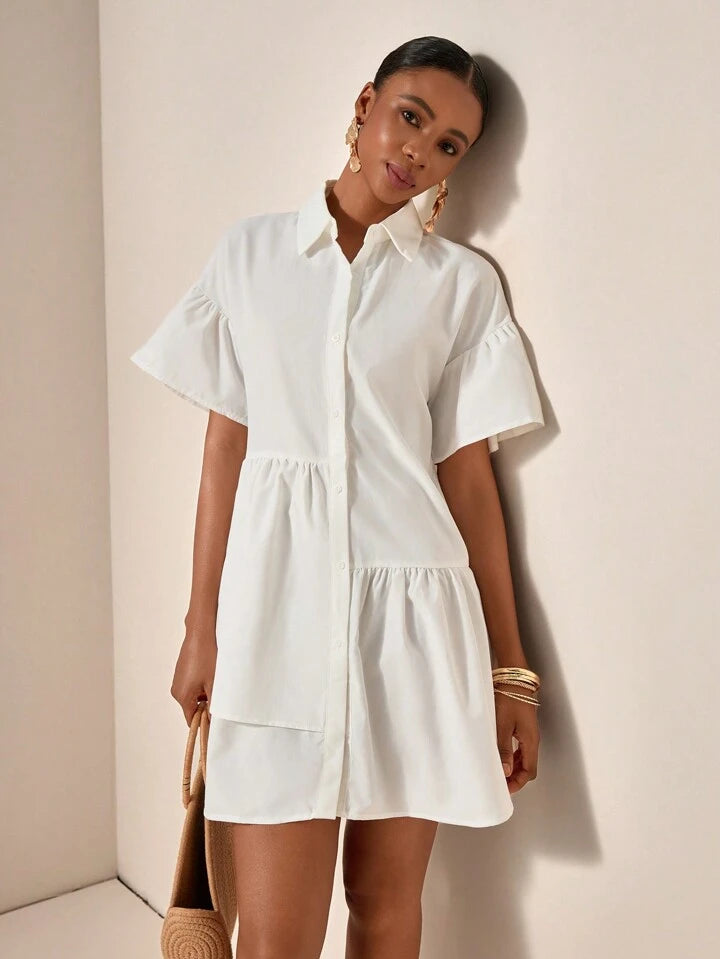 Ruffle hem smock dress in white
