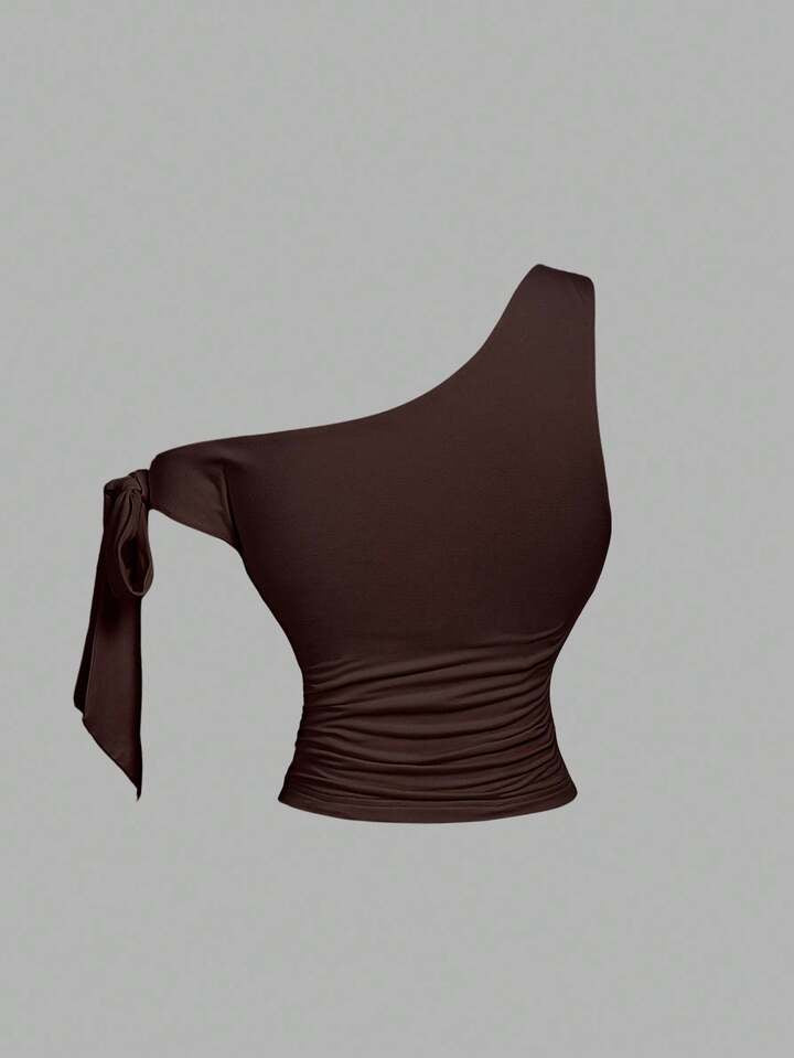 Asymmetrical bowtie metal decor top in brown