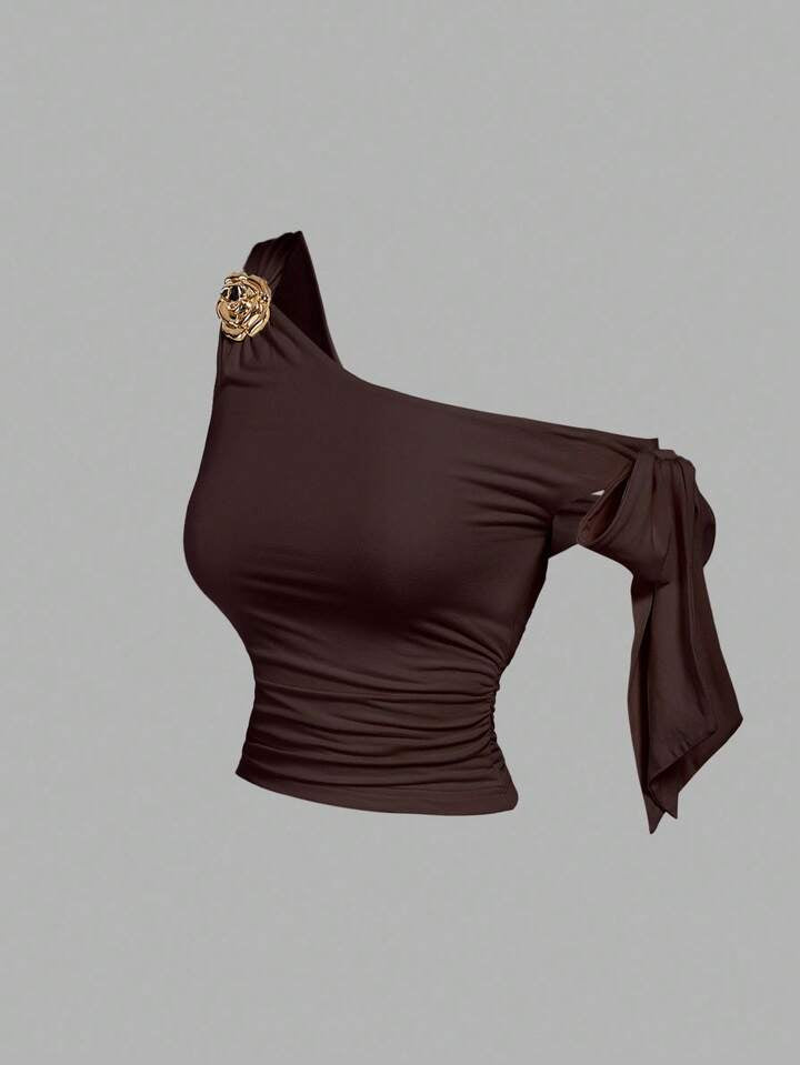 Asymmetrical bowtie metal decor top in brown