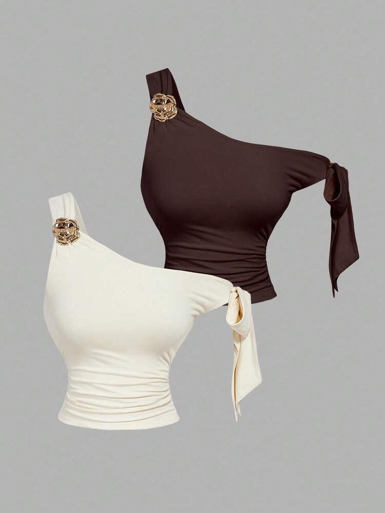 Asymmetrical bowtie metal decor top in brown