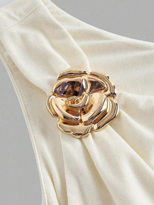 Asymmetrical bowtie metal decor top in nude