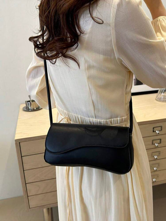 Asymmetrical flap adjustable shoulder bag in black