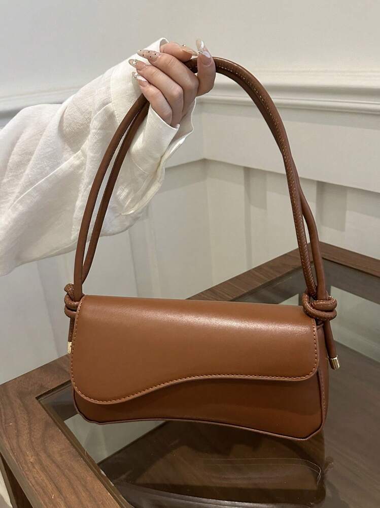 Asymmetrical flap adjustable shoulder bag in brown