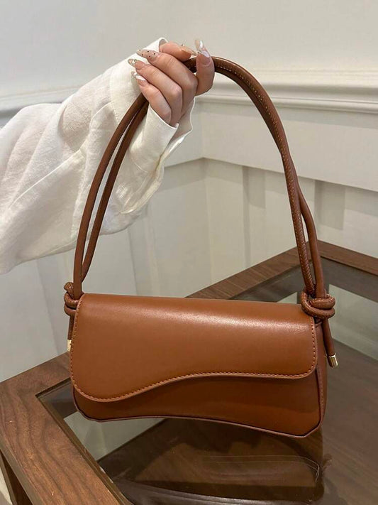 Asymmetrical flap adjustable shoulder bag in brown