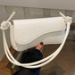 Asymmetrical flap adjustable shoulder bag in white