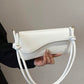 Asymmetrical flap adjustable shoulder bag in white