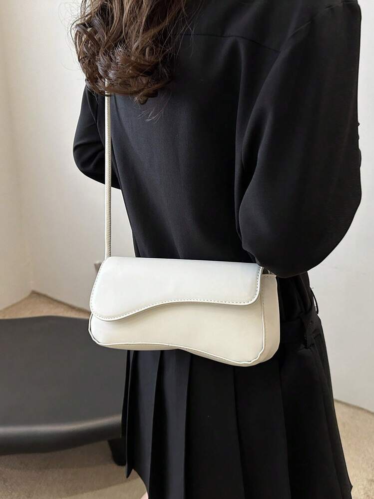 Asymmetrical flap adjustable shoulder bag in white