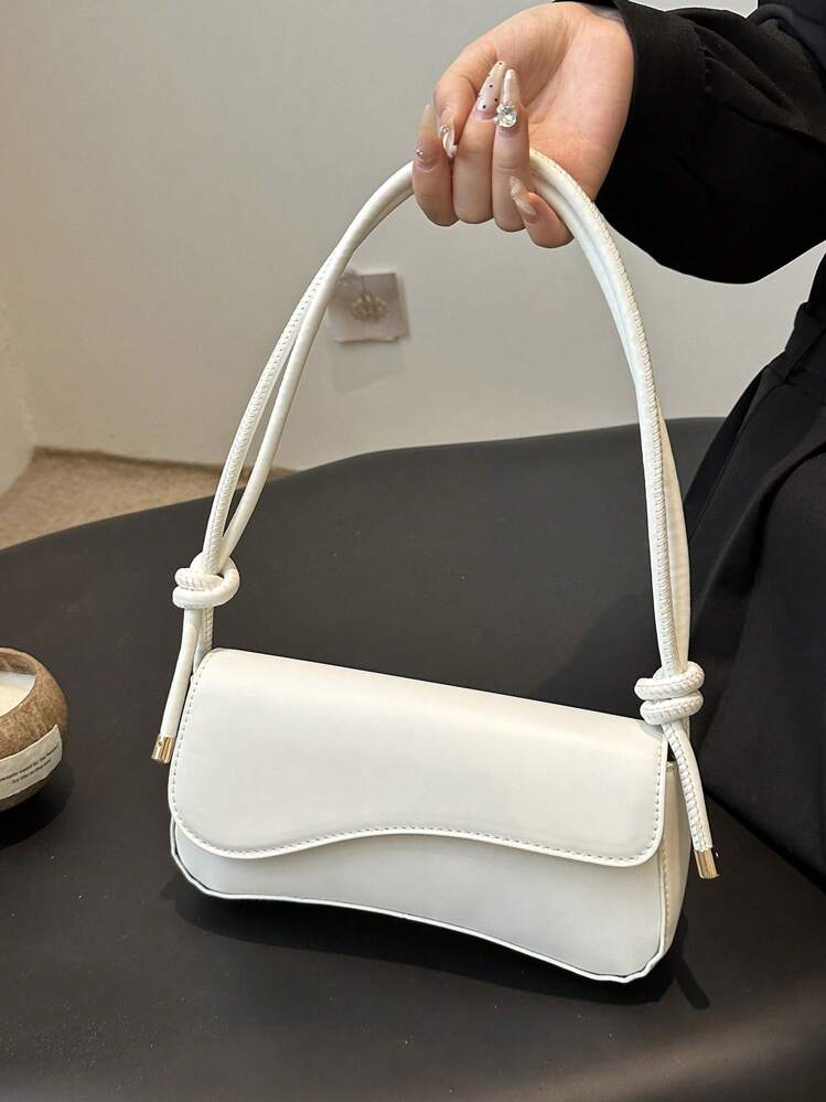 Asymmetrical flap adjustable shoulder bag in white