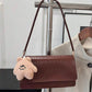 Crocrodile embossed flap shoulder bag in brown