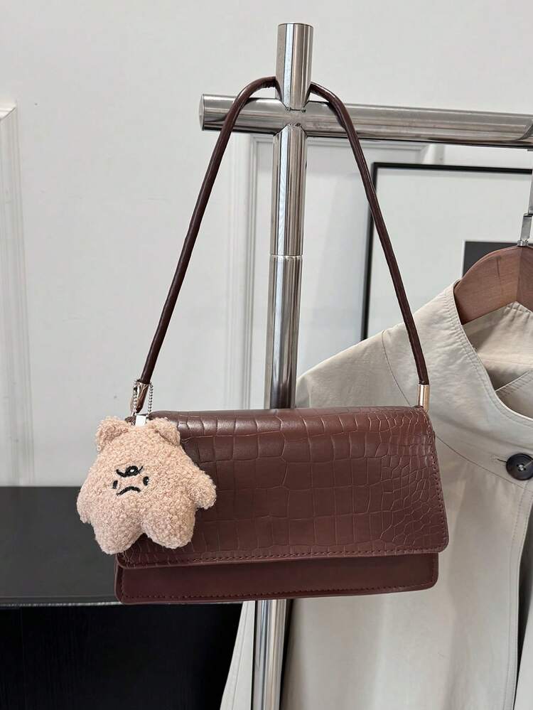 Crocrodile embossed flap shoulder bag in brown