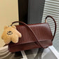 Crocrodile embossed flap shoulder bag in brown