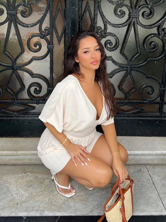 Deep v-neck batwing sleeve pleated romper in nude