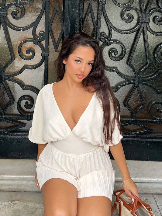 Deep v-neck batwing sleeve pleated romper in nude