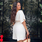 Deep v-neck batwing sleeve pleated romper in nude