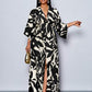Floral printed v-neck long ruffle sleeve split thigh maxi in black
