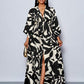 Floral printed v-neck long ruffle sleeve split thigh maxi in black
