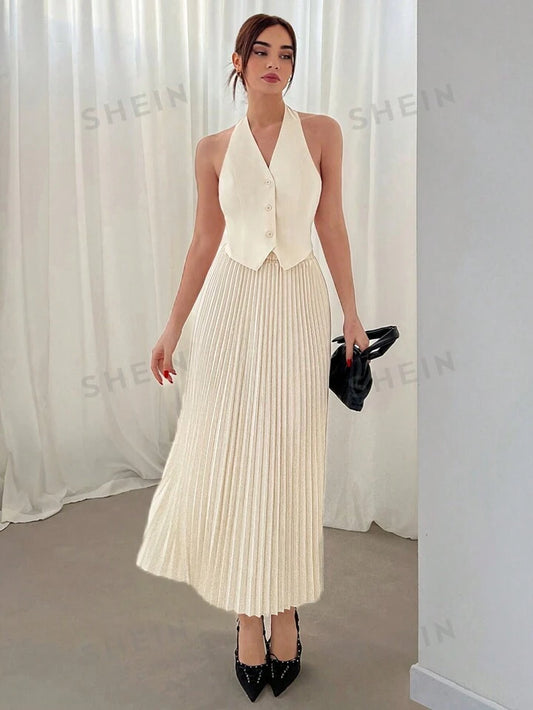 Halterneck vest and pleated skirt set in nude