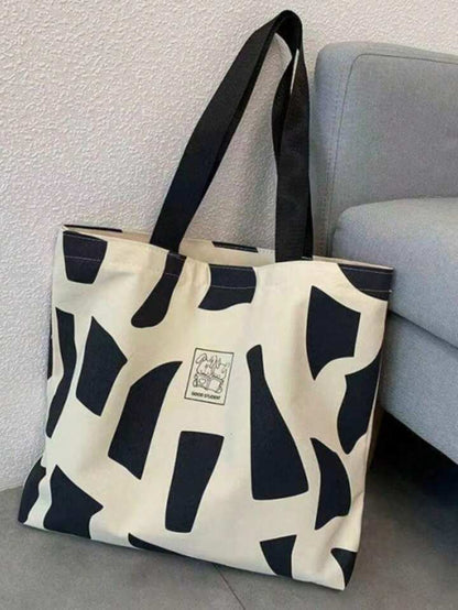 Letter graphic geometric pattern tote bag in black