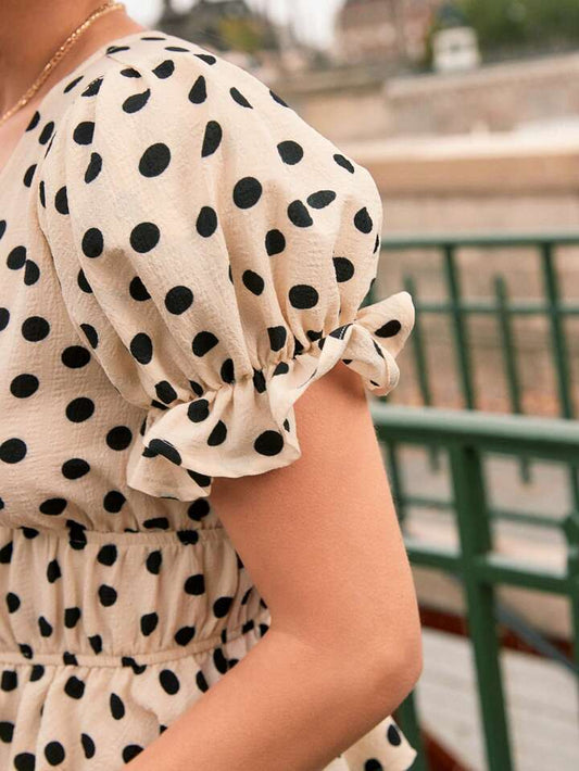 Polka dot print tie front ruffle hem blouse