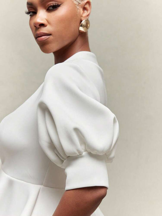 Puff sleeve peplum hem gold button top in white