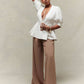 Puff sleeve peplum hem gold button top in white