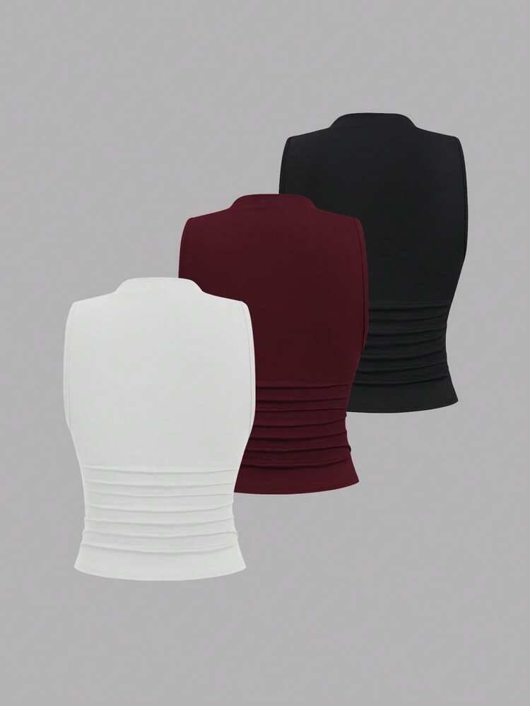 Ruched gold decor top in black