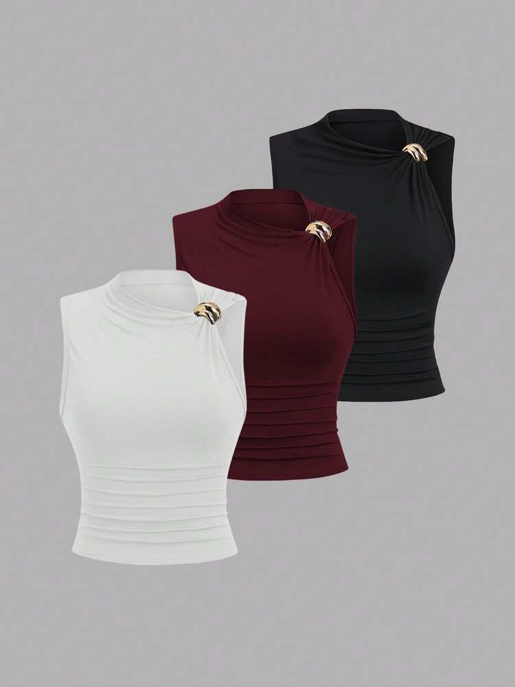 Ruched gold decor top in black