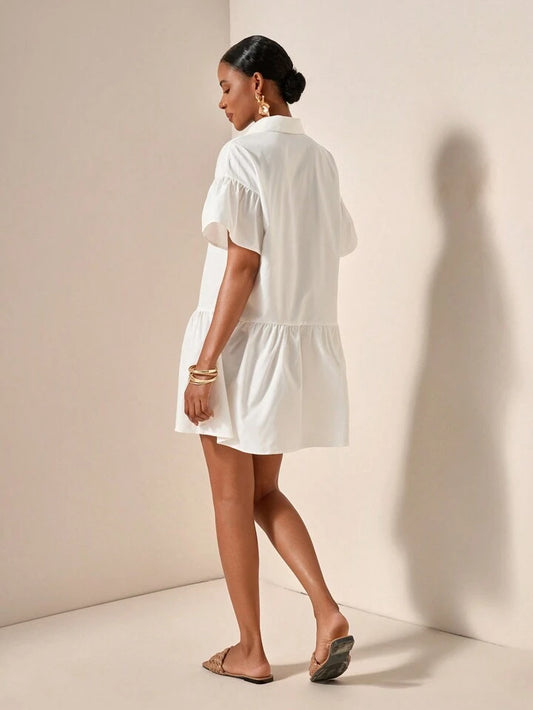Ruffle hem smock dress in white