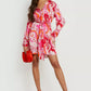 Satin swirl print belted dress in orange