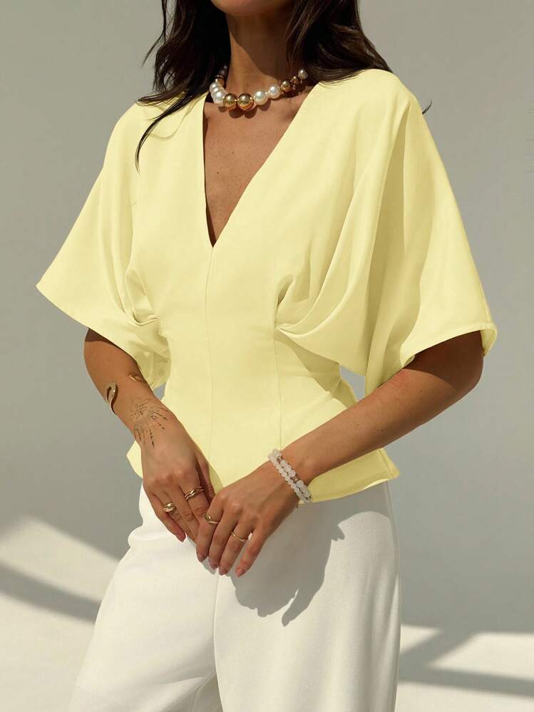 Short sleeve loose fitting blouse in yellow