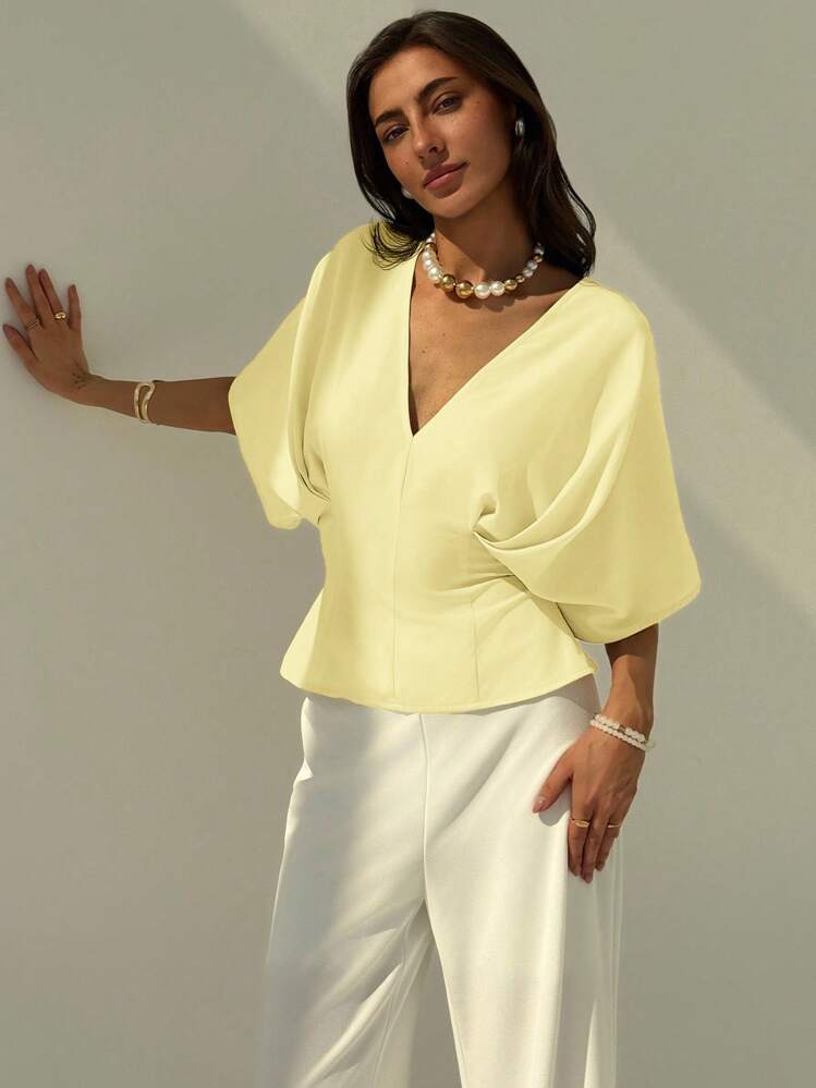 Short sleeve loose fitting blouse in yellow