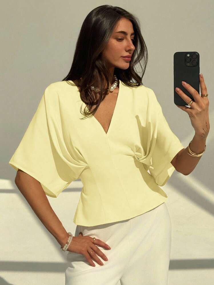 Short sleeve loose fitting blouse in yellow