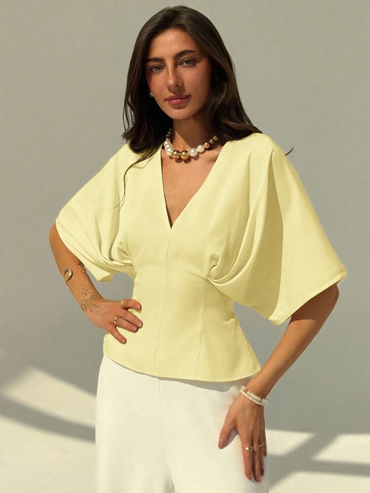 Short sleeve loose fitting blouse in yellow