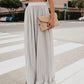 Solid color high waist pleated maxi skirt in white