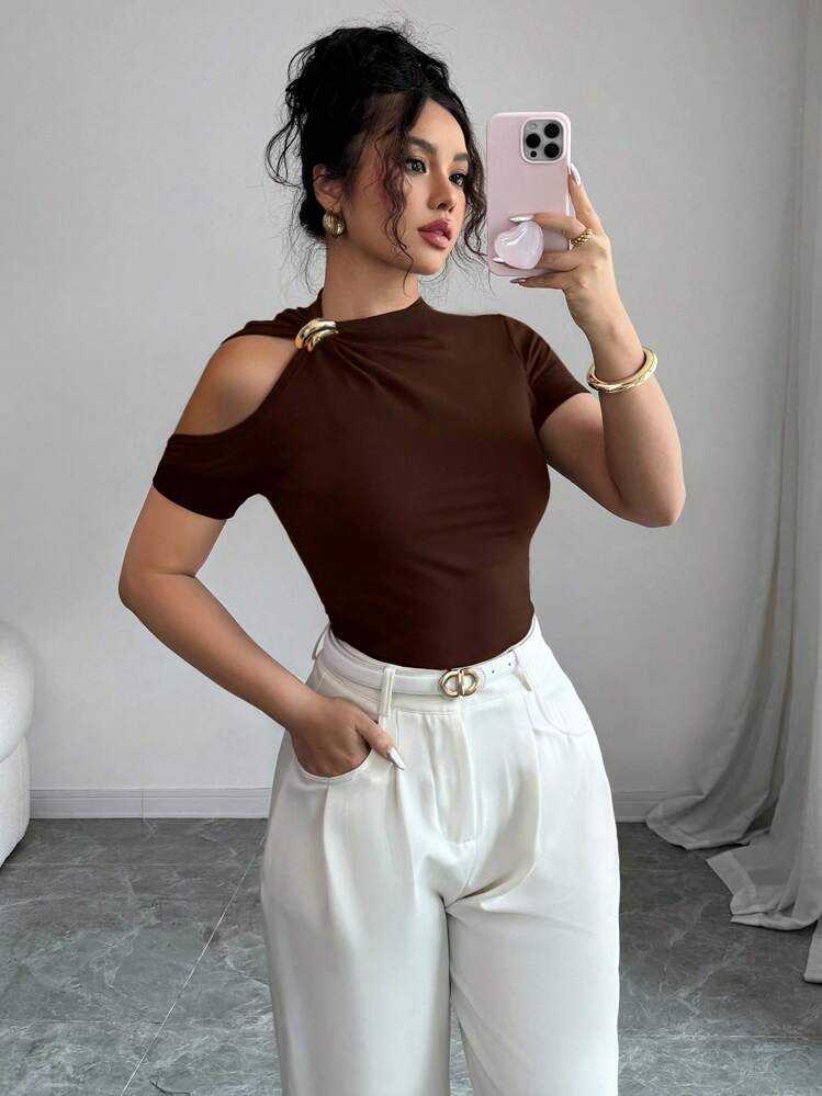 Solid hollow out metal decorated top in brown