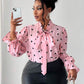 Heart shaped tie detail blouse in pink